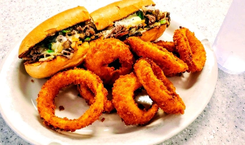 Philly Cheesesteak and onion rings at Punchy's Diner