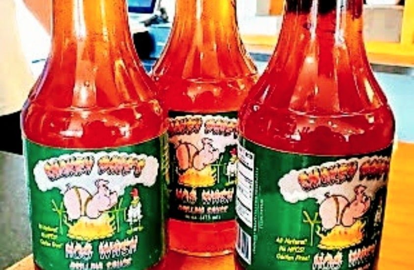 Three bottles of Smokey Dave's BBQ Sauce