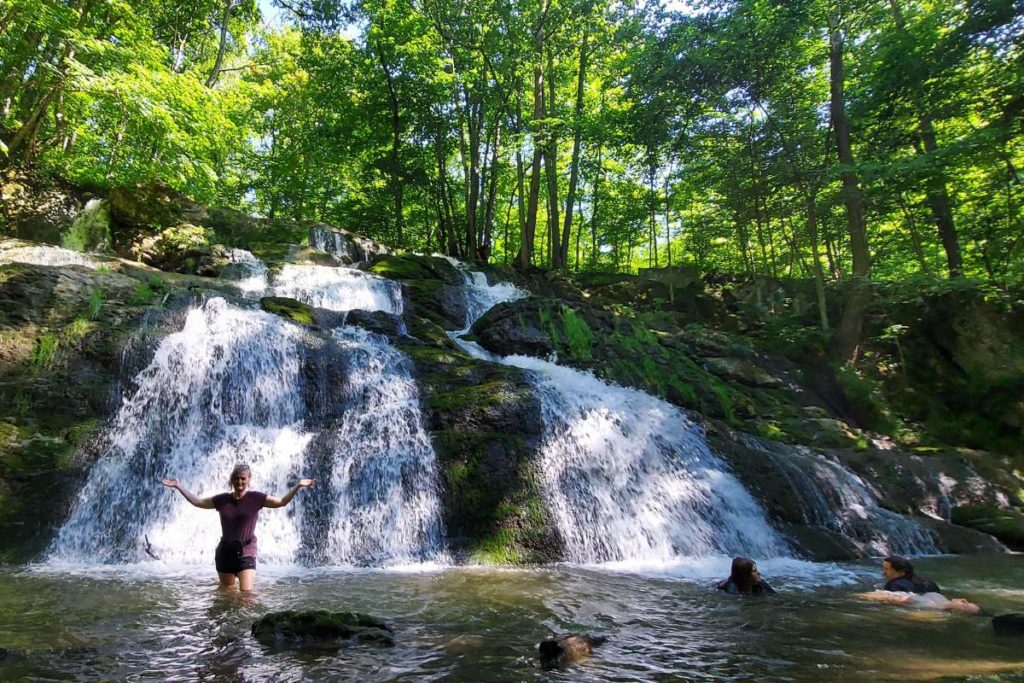 Kristen playing in the water at Falls of Logan Creek